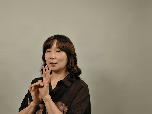 Listening and gesturing during the interview.